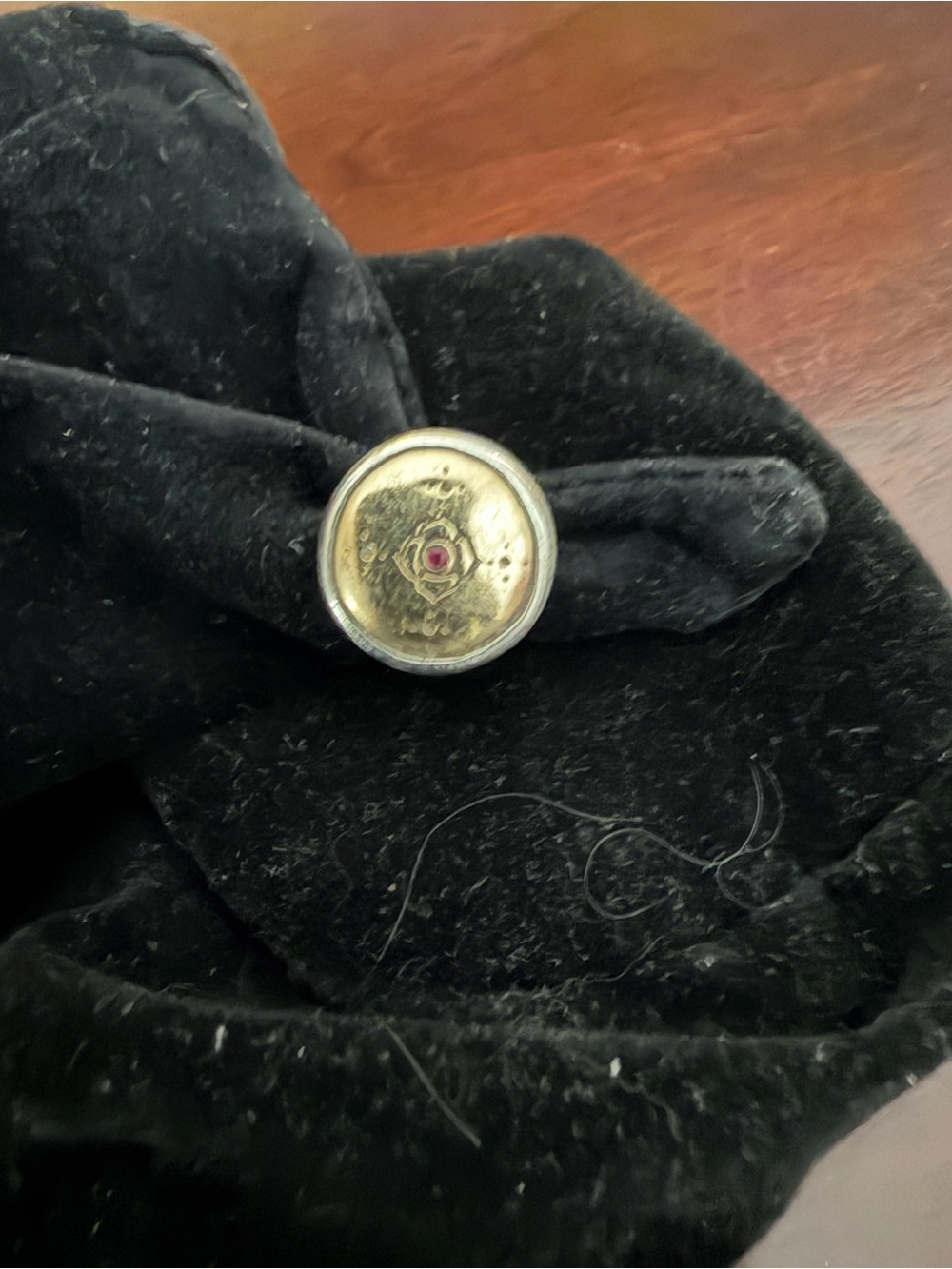Sterling silver ring with 10kt gold ring with a lotus flower in center